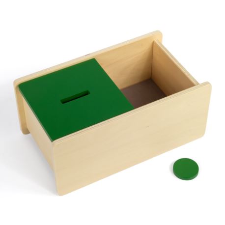 Pudełko z zieloną pokrywką i krążkiem